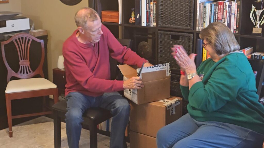 Gary Kidney unboxing his World War II spy novel The Eagle Scout Picture