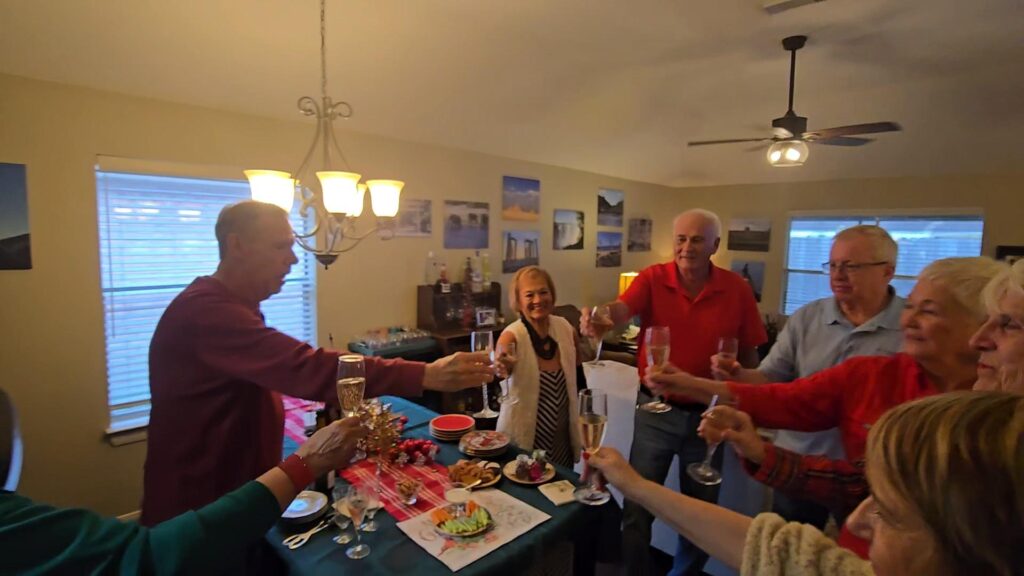 The group toasts to the success of the spy story set in Nazi Germany, The Eagle Scout Picture.